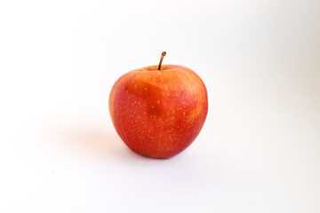 Red Apple on White Background. Single fresh red apple isolated on white background with natural shine.