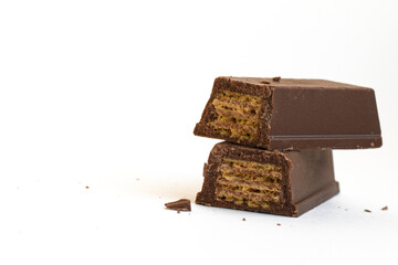 Chocolate Wafer Bar Close Up. Chocolate covered wafer bar broken in half with visible crispy filling.