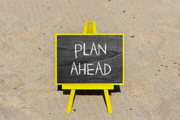 Plan ahead symbol. Concept word Plan ahead on beautiful black blackboard. Beautiful sand beach background. Black blackboard. Business plan ahead concept. Copy space.