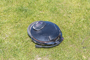 Electric unicycle leaning on the green grass background