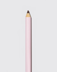 Modern pink lip liner on soft grey background