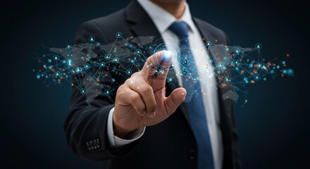 Man in suit touches digital world map with glowing particles on dark background.