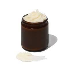 Whipped beef tallow skincare in amber jar on white background with texture