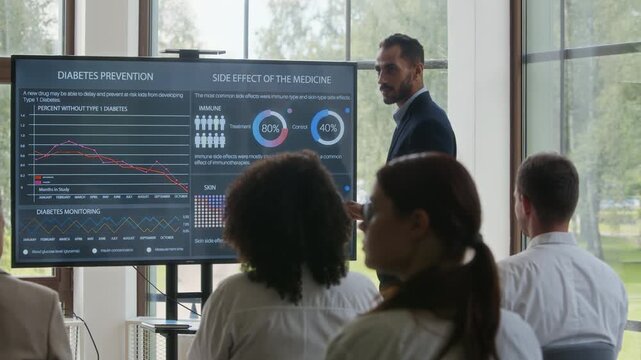 Young Middle Eastern man speaking about diabetes prevention during medical conference in modern hospital - Powered by Adobe