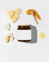 Whipped beef tallow moisturizer in amber jar with product ingredients 