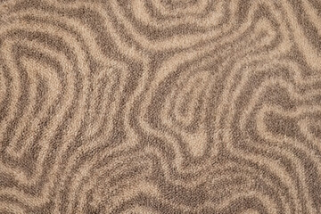 Textured carpet with abstract wavy pattern
