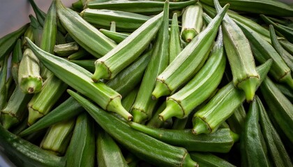 Obraz premium Dense Pile Of Fresh Green Okra Pods Tightly Packed