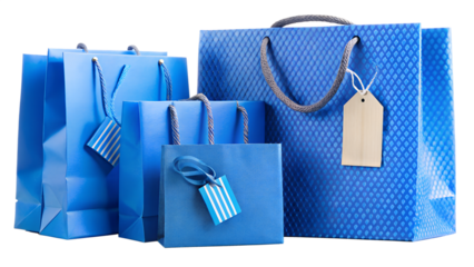 A collection of blue shopping bags with textured patterns and blank tags isolated on transparent background, ideal for branding and advertising