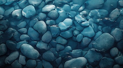 Gray sea pebble background with natural stone texture under water.