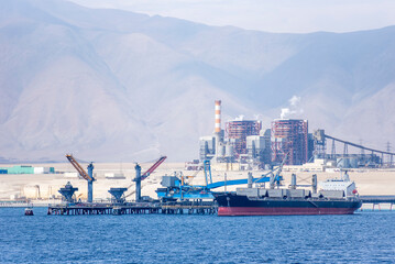 Industrial zone in Mejillones, Puerto Angamos, Chile, near the Atacama Desert. Features include...