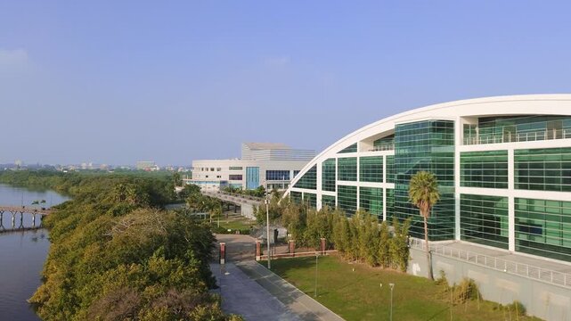 Tampico Mexico 12 29 2024 Drone view of the City Theater surrounded by forest and Laguna del Carpintero during the day with clear blue sky