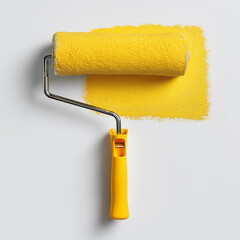 Obraz premium yellow paint roller isolated on a white background