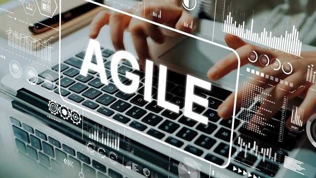 Hands Typing on Laptop with Agile Concept and Digital Analytics Overlay for Business Technology and Innovation Themes. Asymptotic smart data analytic.