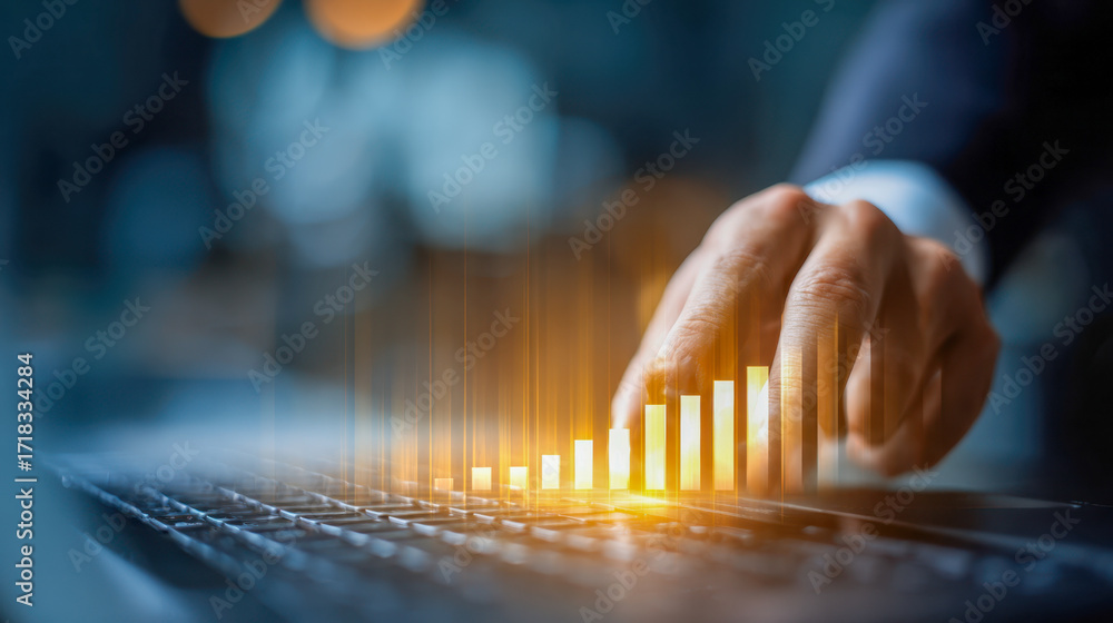 Poster businessman analyzing digital bar chart projections with illuminated growth data displayed above lap