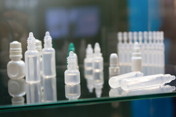 Bottles for medical liquids on the exhibition shelf
