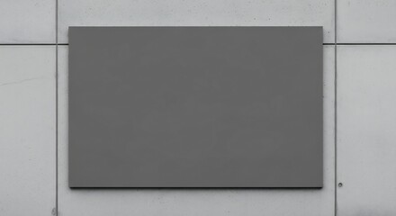 Blank dark gray rectangular sign mockup on a modern light concrete wall texture, perfect for custom branding display.