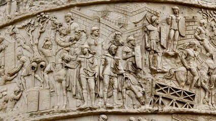 Rome, Italy - 11 January 2025. Trajan’s Column shows a military scene with Roman leaders and cavalry assembling near a fort and engineering works.