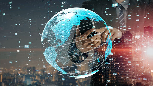 A businessman holds a smartphone while surrounded by a digital globe and an illuminated city skyline. This image captures the essence of global connectivity and technological advancement. Xenic