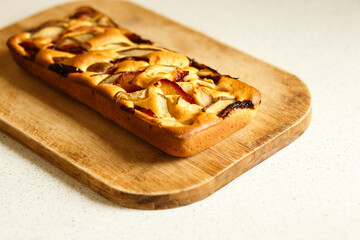 Homemade Apple Pie on Wooden Cutting Board – Rustic Autumn Dessert