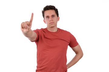 Man wearing a red shirt on a white background making a no sign, negation