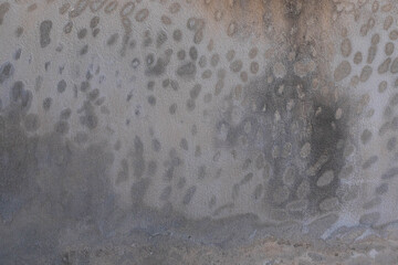 Concrete wall texture featuring cracks, stains, and weathered patterns. Perfect for backgrounds, graphic design, 3D modeling, and architectural visualization. Authentic raw material feel