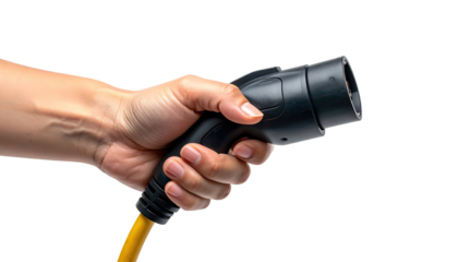 Hand holding an EV charging plug (1)