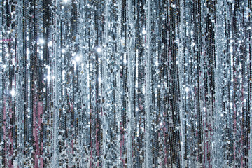 Shimmering silver backdrop creates a festive atmosphere for special events and celebrations