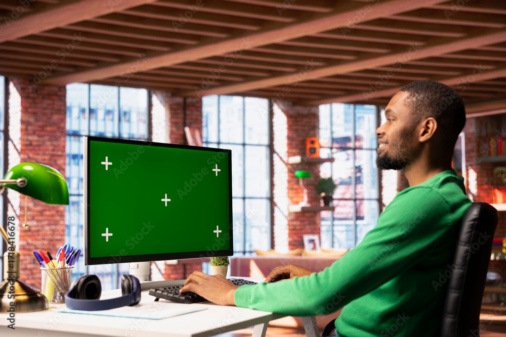 Aufkleber happy man using chroma key pc in apartment to write emails. smiling remote worker typing on mockup c