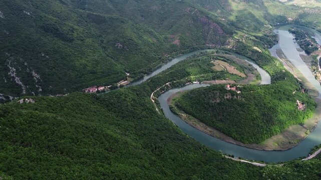 Drone view of Ovcar-Kablar Gorge in Serbia with the winding West Morava River surrounded by green hills and dramatic landscape. Horizontal 4k footage