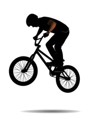 Fototapeta premium Silhouette of a biker performing a jump