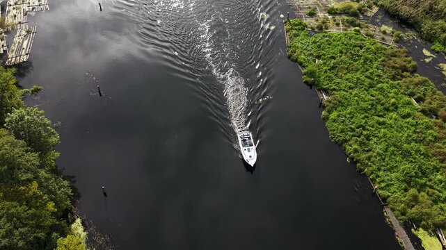 Aerial Bydgoszcz Poland boat Brda river log raft. Northern Poland. River Brda inland waterway, tributary Vistula. Host international regatta rowing competition. Recreation, fishing and transportation.