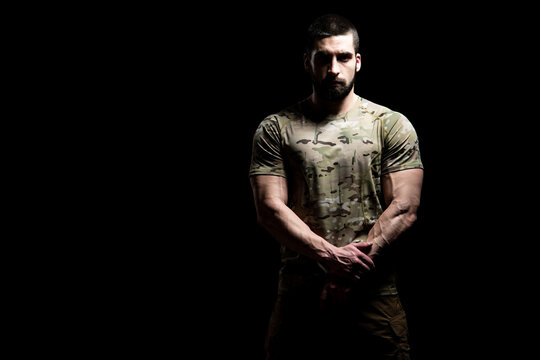 Warrior With Gun on a Black Background