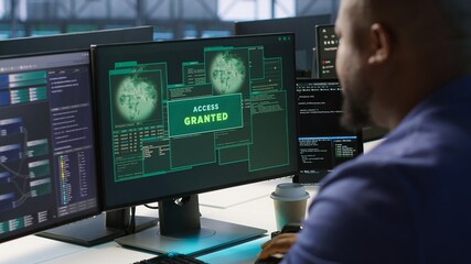 Satisfied server hub programmer pleased after installing cybersecurity framework, seeing access granted notification after reducing security incidents and enhancing data protection protocols, camera A