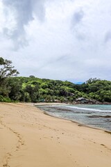 Tropical beach in Seychelles Islands with lush vegetation