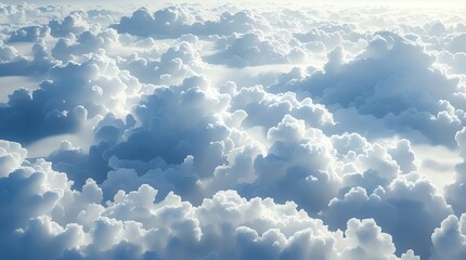 An aerial view of fluffy white clouds illuminated by sunlight