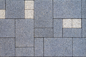 Pattern of paving stones in gray and white shades with rough textured surface. Concept of pavement, stone pattern, construction for decorative outdoor flooring, natural geometric background