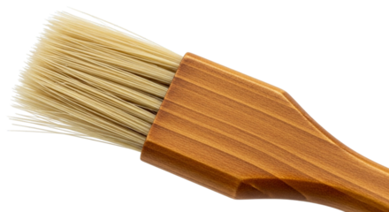 Close-up of a pastry brush's natural bristles and wooden handle for baking isolated on white and transparent background