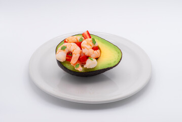 AVOCADO AND SHRIPS ON A WIHTE BACKDROP