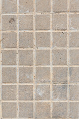 A beautiful vertical texture of a gray path in the park