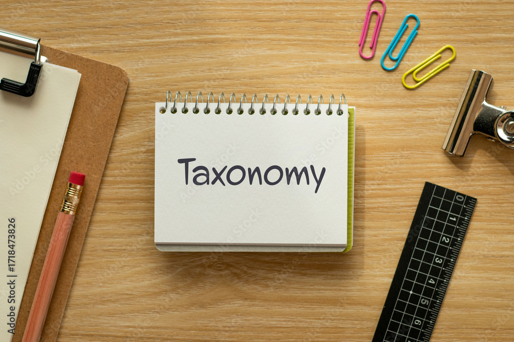 Poster There is notebook with the word Taxonomy. It is as an eye-catching image.