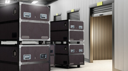 Black storage containers stacked near metallic roller doors in warehouse or storage facility. Activity: Warehouse, Logistics, Storage.