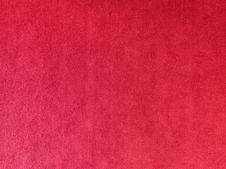 Red textured fabric background with soft surface, suitable for design, wallpaper, or product presentation.

