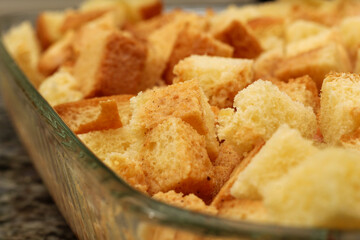 Unbaked Diced Bread Pudding in Baking Dish Ready to Cook