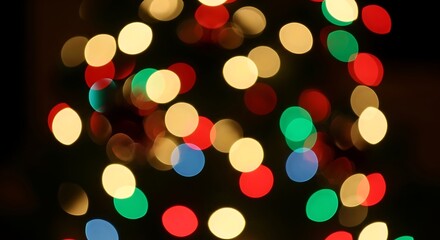 Obraz premium Festive Light Orbs: Colorful, soft-focus light orbs create a dreamy, magical ambiance, ideal for holiday, celebration, or background design projects. The bokeh effect enhances the aesthetic.
