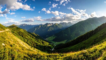 Fototapeta premium Scenic Mountain Range Panorama with Lush Green Slopes and a Bright Blue Cloudy Sky