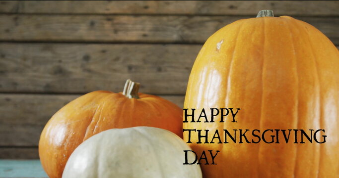 Fototapeta Image of happy thanksgiving day text over autumn pumpkins