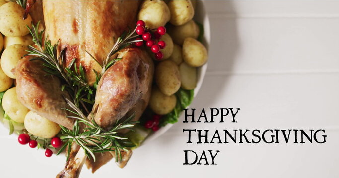 Image of happy thanksgiving day text over thanksgiving dinner on white boards