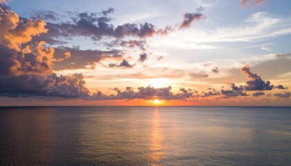 Panoramic sunset over calm ocean