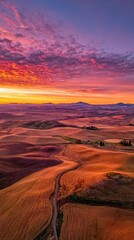 Naklejka premium Dramatic Sunset Over Rural Landscape