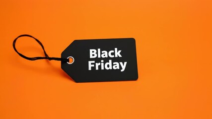 Black Friday Sale Tag on Orange Background for Shopping Promotion